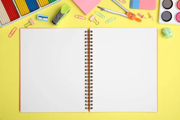 Flat Lay Composition Notebook Different School Stationery Pale Yellow Background — Stock Photo, Image