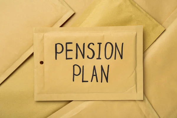 Words Pension Plan written on envelope, top view