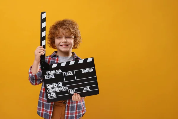 Smiling Cute Boy Clapperboard Orange Background Space Text Little Actor — Stock Photo, Image