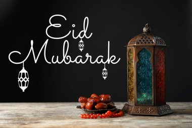 Eid Mubarak greeting card. Muslim lantern, dates and misbaha on wooden table clipart