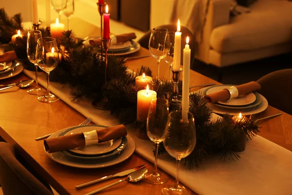 stock image Festive table setting and beautiful Christmas decor in room. Interior design