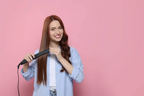 Beautiful Woman Using Hair Iron Pink Background Space Text — Stock Photo, Image