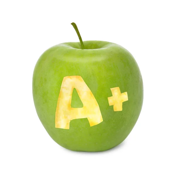 Green apple with carved letter A and plus symbol as school grade on white background