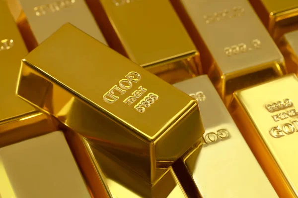 Stock image Many shiny gold bars as background, closeup