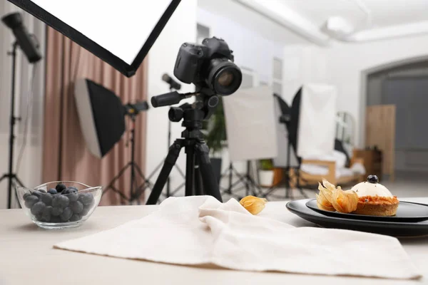 stock image Professional equipment and composition with delicious dessert on wooden table in studio. Food photography