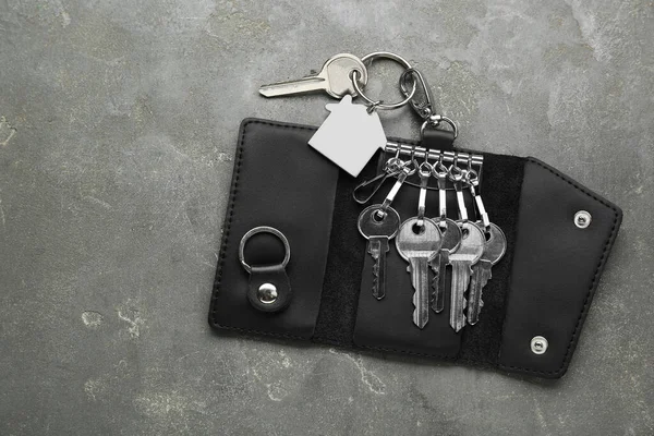 Stylish Leather Holder Keys Grey Textured Table Top View Space — Zdjęcie stockowe