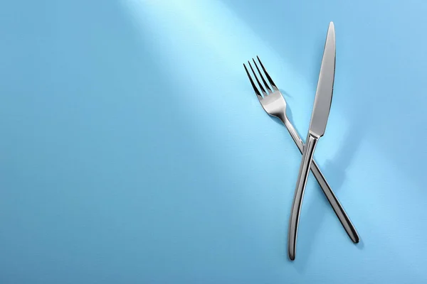 Shiny Fork Knife Light Blue Background Flat Lay Space Text — Stock Photo, Image