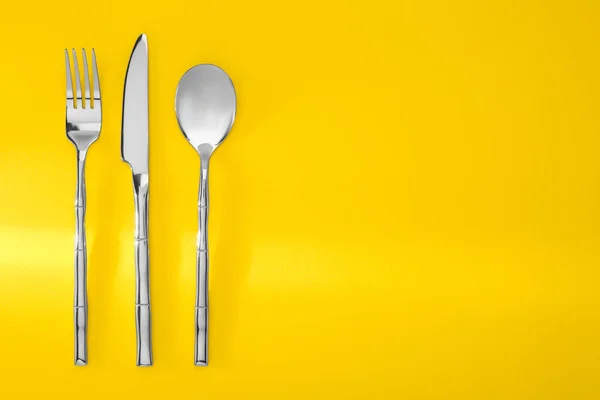 Spoon Fork Knife Yellow Background Flat Lay Space Text — Stock Photo, Image