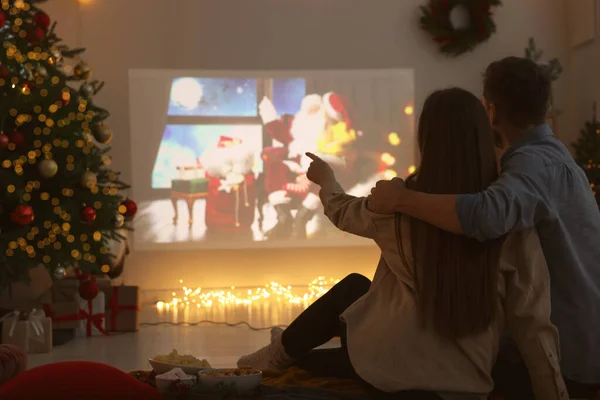 Couple Watching Christmas Movie Video Projector Cosy Room Back View — Stock Photo, Image