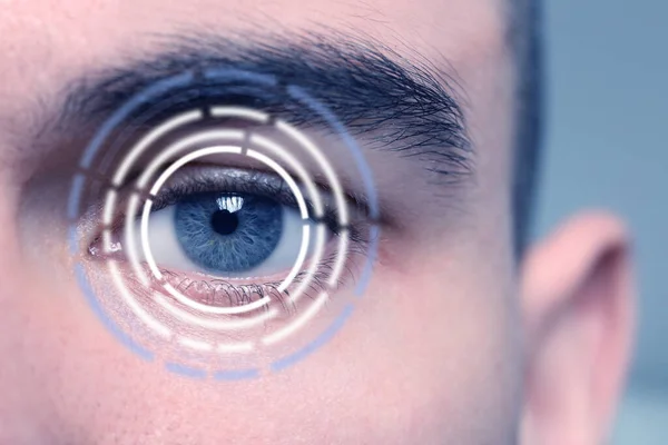 Vision test. Laser reticle focused on man\'s eye, closeup