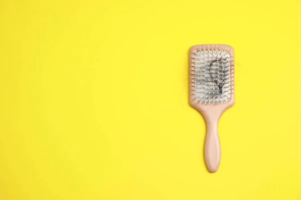Wooden Brush Lost Hair Yellow Background Top View Space Text — Stock Photo, Image