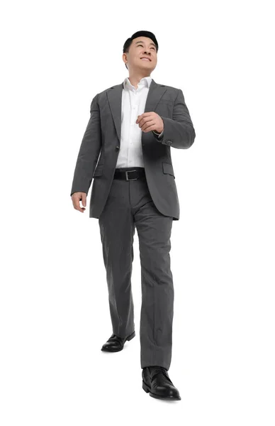 Beyaz Arka Planda Yürüyen Takım Elbiseli Adamı Düşük Açılı Görünüm — Stok fotoğraf