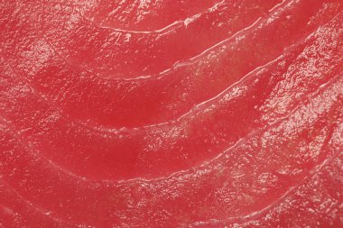 Arka plan olarak taze çiğ ton balığı filetosu, üst görünüm