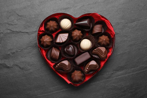 Heart Shaped Box Delicious Chocolate Candies Black Table Top View — Stock Photo, Image