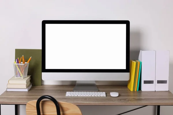 stock image Cozy workspace with modern computer and stationery on wooden desk