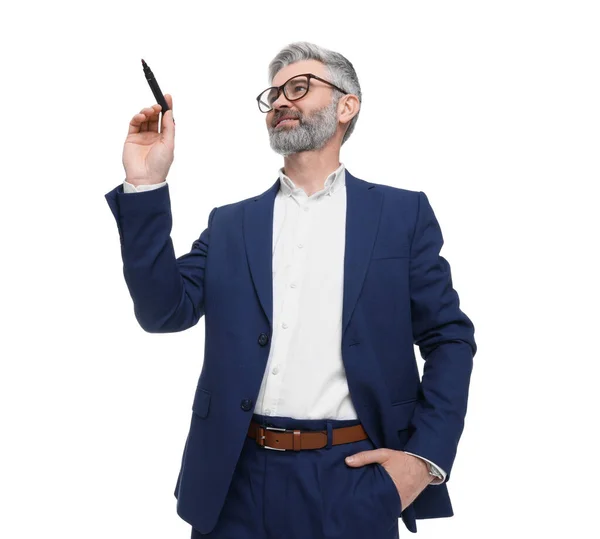 Mature businessman with marker on white background, low angle view