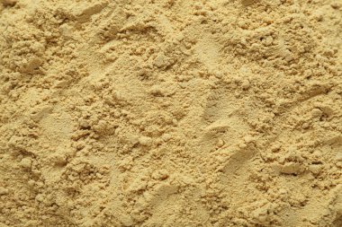 Aromatic mustard powder as background, top view
