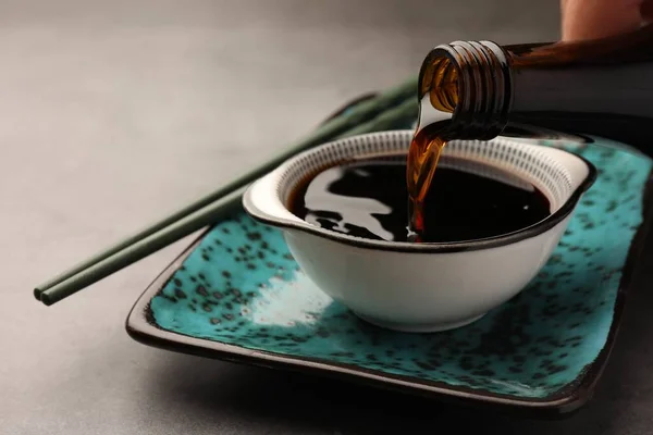 Pouring Soy Sauce Bowl Grey Table Closeup — Stock Photo, Image
