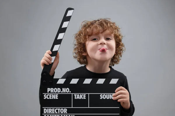 Happy Cute Boy Clapperboard Grey Background Little Actor — Stock Photo, Image
