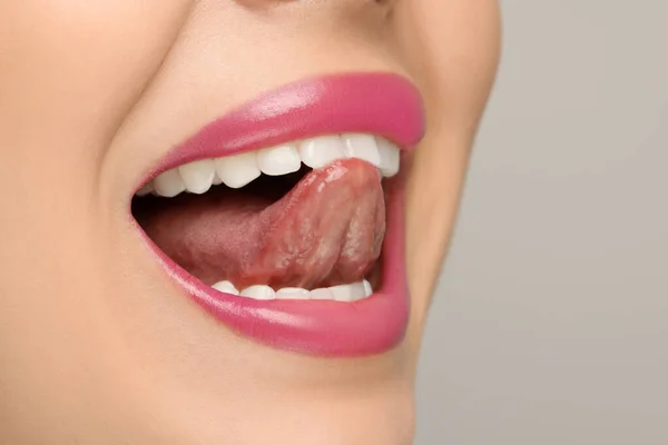 Woman Showing Her Tongue Light Background Closeup Space Text — Stock Photo, Image
