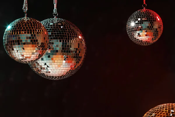 Shiny bright disco balls on dark background