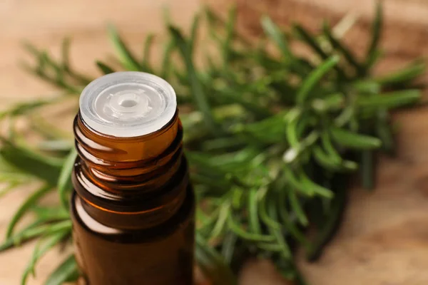 Bottle Essential Oil Fresh Rosemary Blurred Background Closeup Space Text — Stock Photo, Image