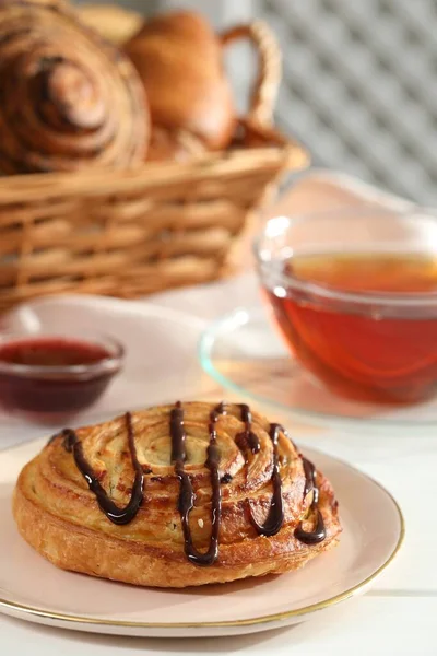 stock image Tasty freshly baked spiral pastry on white table, closeup. Space for text