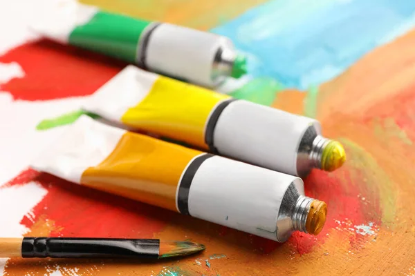 Tubes Colorful Oil Paints Brush Canvas Abstract Painting Closeup — Stock fotografie