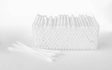 Cotton buds in plastic container isolated on white