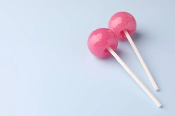Two Tasty Lollipops Light Blue Background Space Text — Stock Photo, Image