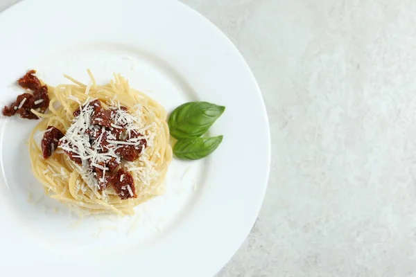 Tasty Spaghetti Sun Dried Tomatoes Parmesan Cheese White Table Top — Stock Photo, Image