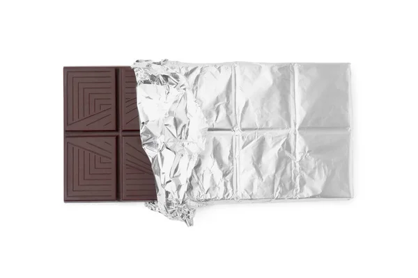 stock image Delicious dark chocolate bar wrapped in foil isolated on white, top view