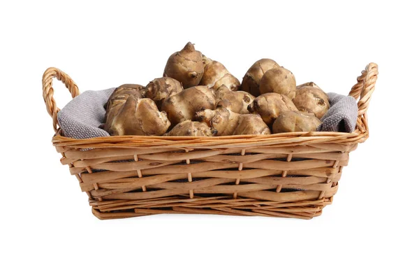 stock image Wicker basket with many Jerusalem artichokes isolated on white