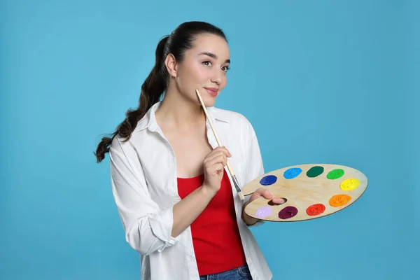 Woman Painting Tools Light Blue Background Young Artist — Stock Photo, Image
