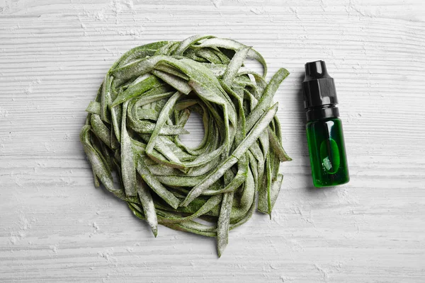 Green Pasta Bottle Food Coloring Flour White Wooden Table Flat — Stock Photo, Image