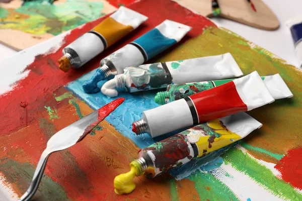 Tubes Colorful Oil Paints Spatula Canvas Abstract Painting Table Closeup — Stock fotografie