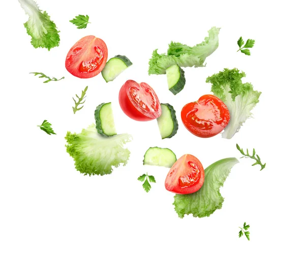 Lettuce Leaves Arugula Parsley Cut Cucumber Tomatoes Falling White Background — Stock Photo, Image