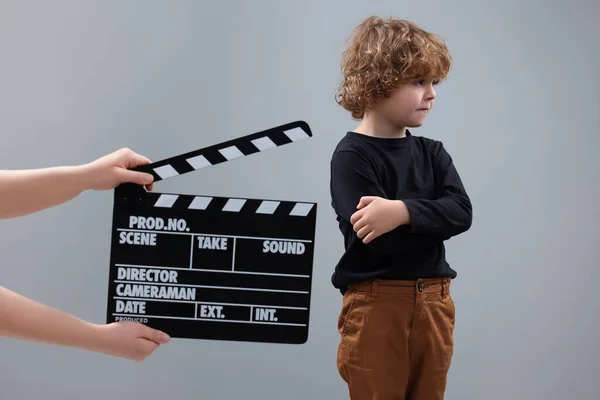 Sad Boy Performing While Second Assistant Camera Holding Clapperboard Grey — Stock Photo, Image