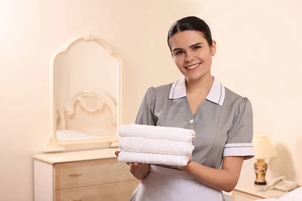 Young Chambermaid Holding Stack Clean Towels Hotel Room Space Text — Stock Photo, Image
