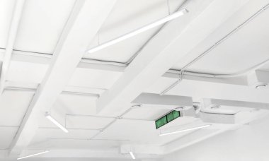 White ceiling with modern lighting in room, low angle view