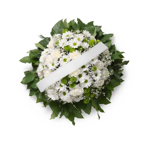 Stock image Funeral wreath of flowers with ribbon on white background, top view