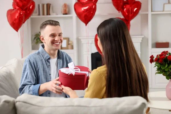 Man Receiving Gift Box His Girlfriend Home Valentine Day Celebration — Fotografia de Stock