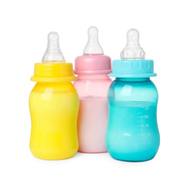 Feeding bottles with milk on white background