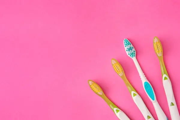 Toothbrushes Pink Background Flat Lay Space Text — Stock Photo, Image