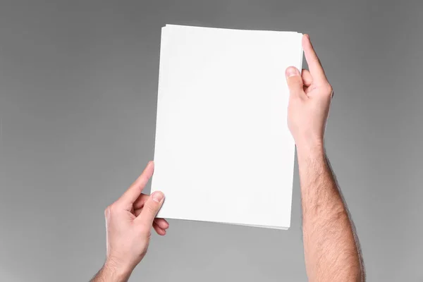 Man Holding Sheet Paper Grey Background Closeup Mockup Design — Photo
