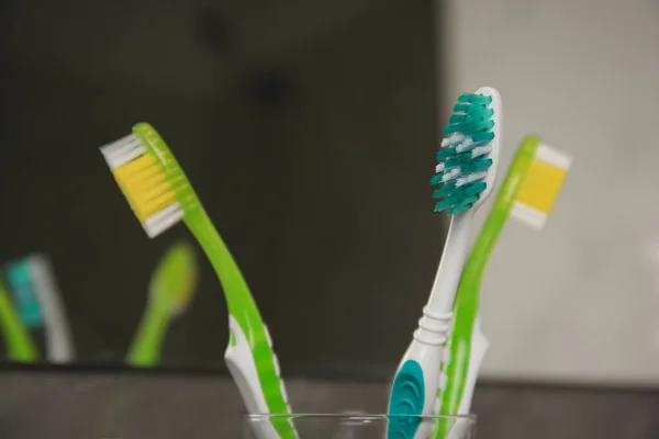 Light Blue Green Toothbrushes Blurred Background Closeup — Stock Photo, Image