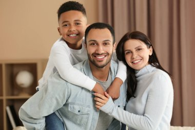 Happy international family spending time together at home