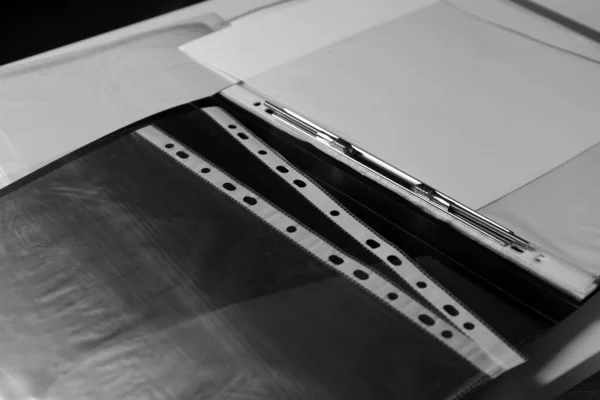 stock image Folders with punched pockets on white table, closeup