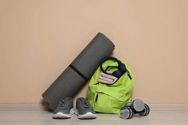 Backpack Sports Equipment Floor Beige Wall — Stock Photo, Image