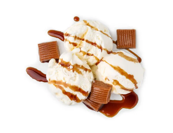 Scoops of ice cream with caramel sauce and candies isolated on white, top view